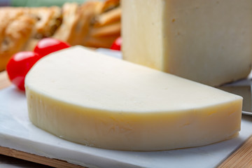 Italian cheeses, mature Tuscan Pecorino sheep cheese and Provolone dolce cow cheese served with olive bread and tomatoes