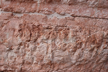 empty ancient raw rough nature pink red stone concrete texture wall for retro restaurant, website, picture frame advertising chart board, home decoration wallpaper fence