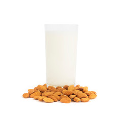 Glass of almond milk with nuts isolated on white.