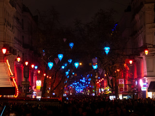 Fototapeta na wymiar LES AMOURS EN CAGE, Rue de la République, Festival of Lights of Lyon 2018