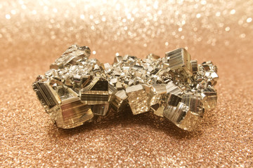 The pyrite crystal on golden background