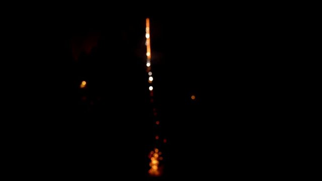 Launch a festive firework, rocket launcher fireworks start from the ground and explode in the dark night sky, stock video