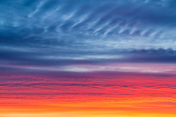 Naklejka na ściany i meble Scarlet sunset with beautiful clouds