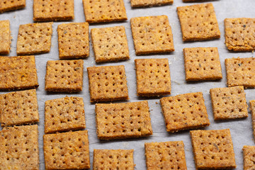 Homemade baked parmesan cheesse crackers with rosemary