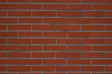 Obraz premium Brick wall with dark and dirty red bricks on it