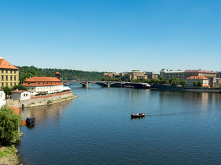 Fototapeta na wymiar Scenic view on Vltava river and historical center of Prague, buildings and landmarks of old town at sunset, Prague, Czech Republic. August, 2018