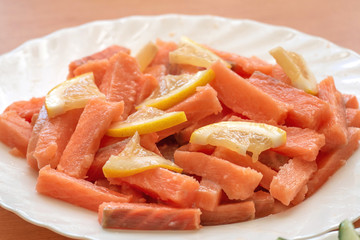 Slices of salted salmon with lemon for sushi rolls