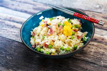 Homemade Chinese fried rice with vegetables and fried eggs