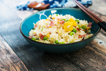 Homemade Chinese fried rice with vegetables and fried eggs