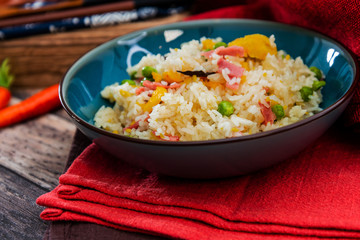 Homemade Chinese fried rice with vegetables and fried eggs