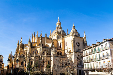Fototapeta na wymiar Segovia, Spain – Segovia cathedral in a winter day seen from plaza Mayor. It was the last gothic style cathedral built in Spain, during the sixteenth century.