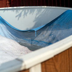swimming pool foil damaged with snow