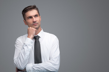 Thoughtful businessman looking away