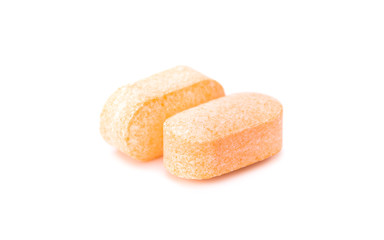 Vitamin C tablet isolated on white background