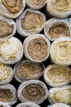 Close Up  Front View Of Round Basalt Mineral Wool Packages  In Plastic Foil .