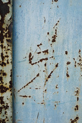 Iron wall with dark brown rust. Corroded metal. Background for design 