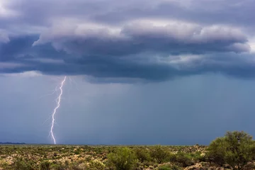 Fotobehang Lightning bolt strike in a storm © JSirlin