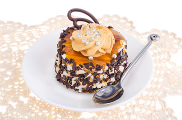 Caramel cake with butter cream and chocolate drops