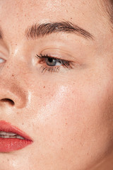 close up of young woman with coral lips and wet skin - obrazy, fototapety, plakaty