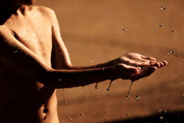 Water flows on the kid hands
