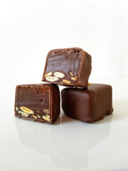 pieces of chocolate on a plate isolated on white