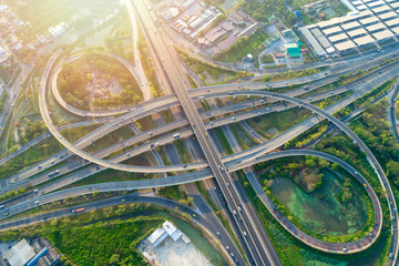 Bangkok Expressway top view, Top view over the highway,expressway and motorway at night, Aerial view interchange of a city, Shot from drone, Expressway is an important infrastructure in Thailand