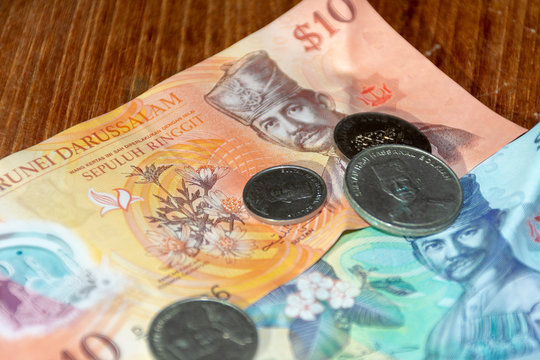 Brunei Darussalem dollars their currency in bills and coins