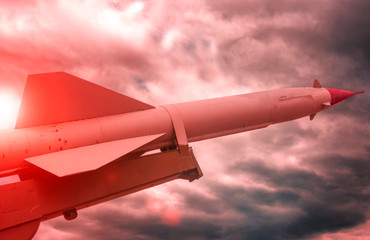 Nuclear missile pointing up at sunset. weapons, army. aggression.
