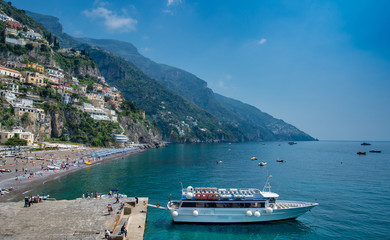 Fototapeta na wymiar Beach and colorful buildings in Positano town at Amalfi Coast, Italy.