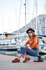 Young stylish girl in a sea port