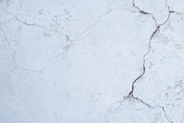 Blue board with cracks from paint. Old wall background.