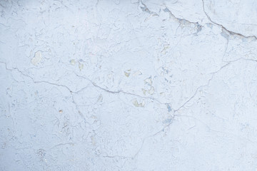 Blue board with cracks from paint. Old wall background.