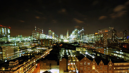 Partial view of London skyline at night using long shutterspeed and zoom