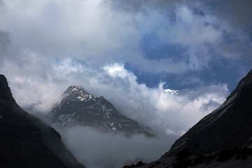 Mountains Nepal. Beautiful summer view with sun and blue sky clouds.