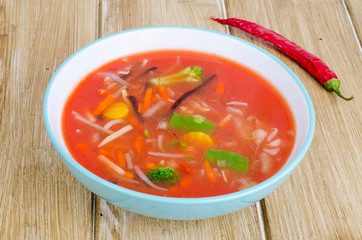 Spicy tomato soup with red peppers and vegetables.