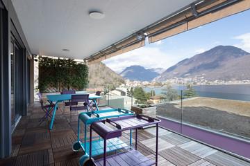 Large terrace with furniture and magnificent view of the lake