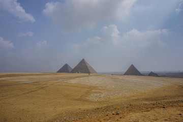 Fototapeta na wymiar Giza, Egypt: View of the Khufu pyramid complex on a misty morning.