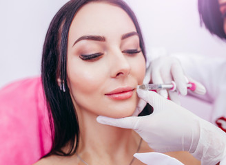 Injections of the lips. Correction form the upper lip. Injection of beauty. Spa. Facial...