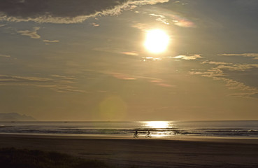 Bicicles in sunrise at the beach
