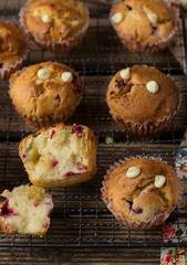 Sweet muffins with raspberries, cranberries and white chocolate chips