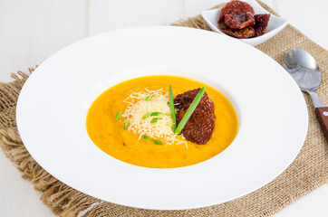 Delicious spicy pumpkin soup with parmesan.