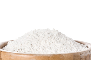 Fototapeta na wymiar White rice flour in a bowl isolated on white background. Close up. Copyspace