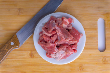 Fresh raw beef steak on wooden background with selective focus
