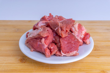 Fresh raw beef steak on wooden background with selective focus
