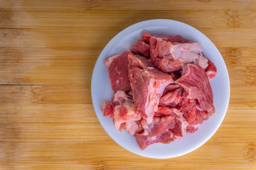 Fresh raw beef steak on wooden background with selective focus