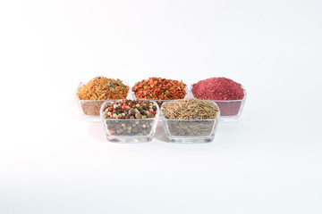 Different spices on the white background