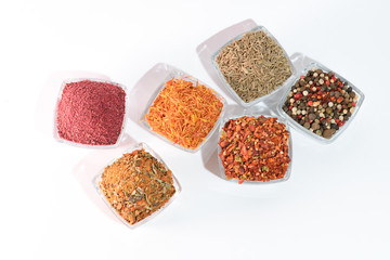 Different spices on the white background