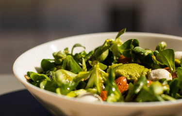 A guacamole salad with cannons, almonds, cheese and honey. 