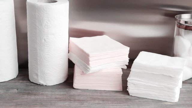 Concept of spa, body care, facial treatment, beauty salon, Paper towels, napkins and cotton pads. Hygienic disposables. Slow pan.