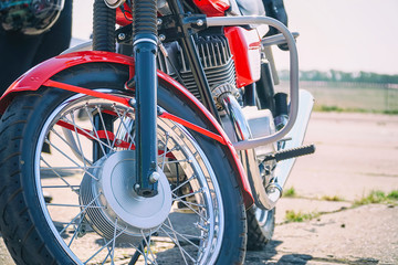 Fototapeta premium The front wheel of the motorcycle. Front view. Selective focus